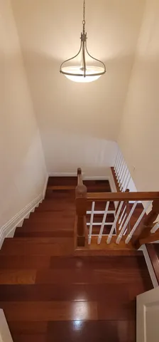 a picture of a room with wooden floor