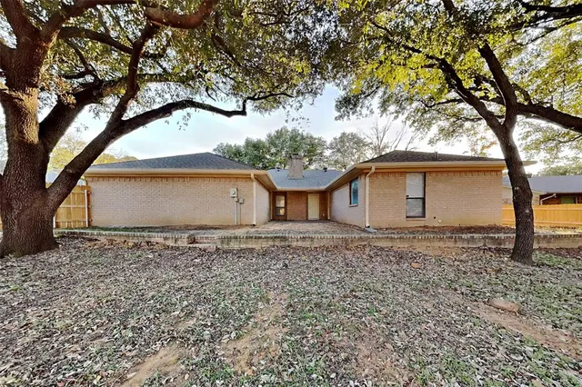a house with trees in the background