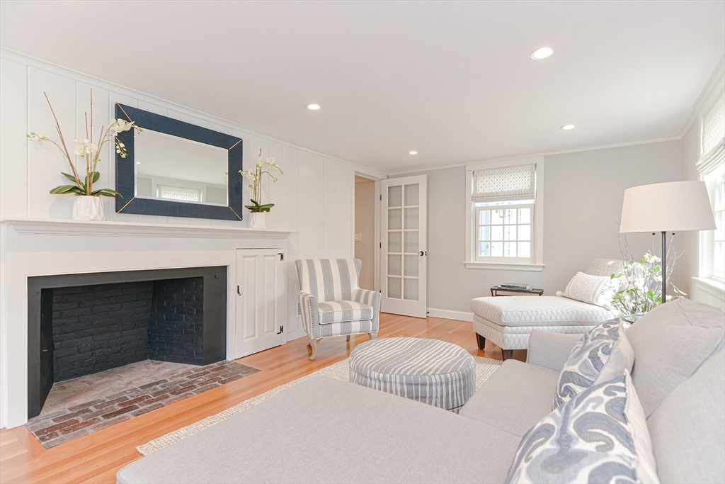 24 Standish Road Wellesley, MA 02481 - Photo 5 of 42 a bedroom with a bed and a fireplace
