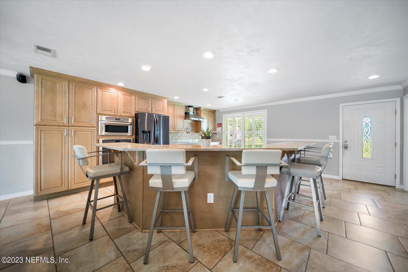 988 Shockney Drive Ormond Beach, FL 32174 - Photo 17 of 46 a view of a dining room with furniture