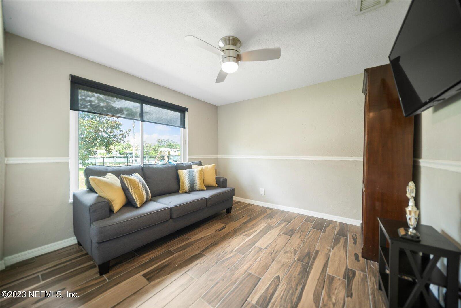 988 Shockney Drive Ormond Beach, FL 32174 - Photo 23 of 46 a living room with furniture and a window