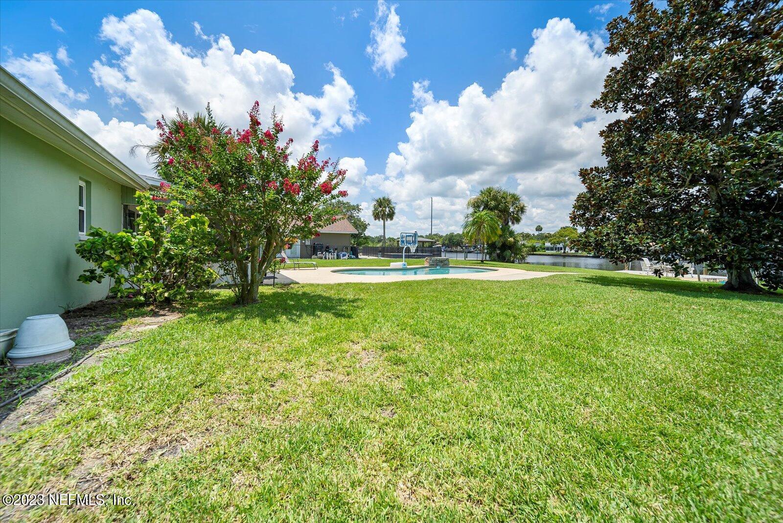 988 Shockney Drive Ormond Beach, FL 32174 - Photo 35 of 46 a view of a fountain in front of a house with a big yard