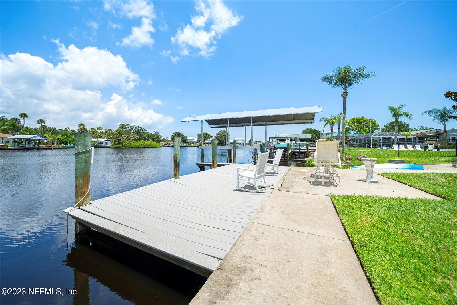 988 Shockney Drive Ormond Beach, FL 32174 - Photo 39 of 46 a view of a patio with swimming pool