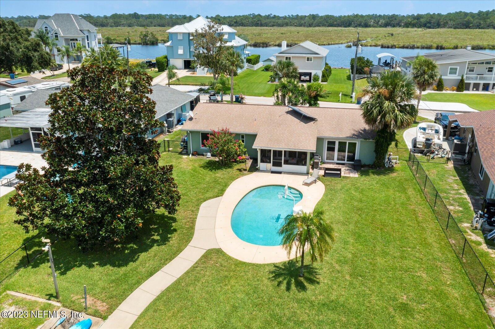 988 Shockney Drive Ormond Beach, FL 32174 - Photo 6 of 46 an aerial view of residential houses with outdoor space and swimming pool