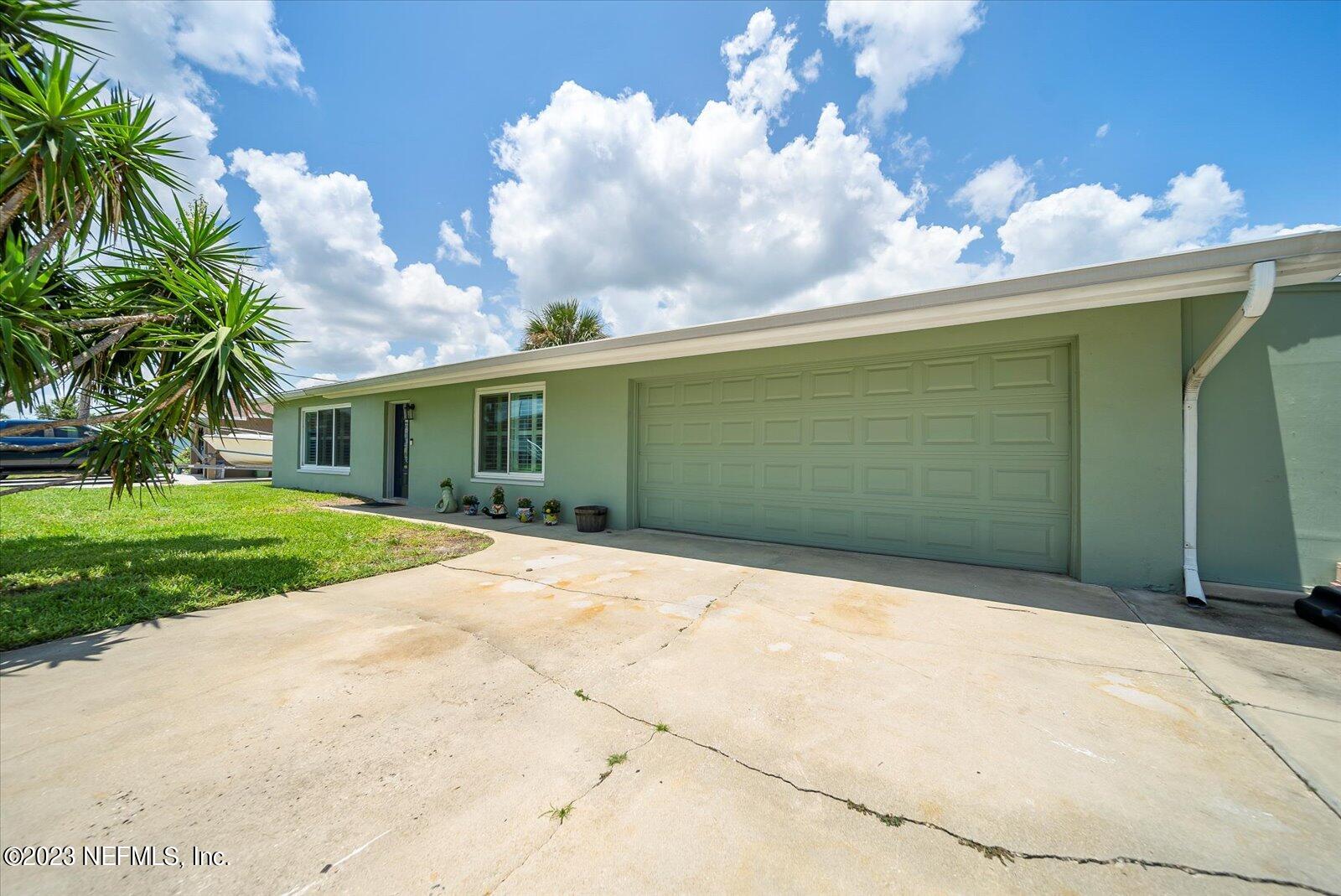 988 Shockney Drive Ormond Beach, FL 32174 - Photo 7 of 46 a front view of a house with garden