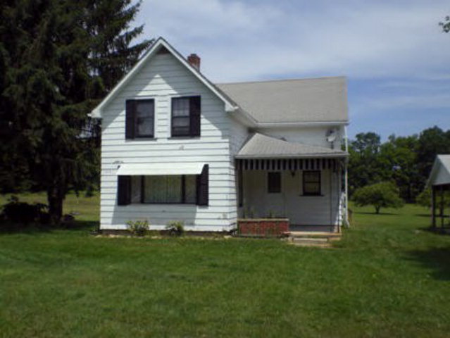 699 Highway 157 Oil City, PA 16301 - Photo 1 of 1 a front view of house with yard and green space