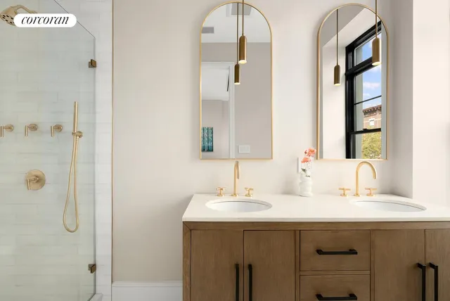 a bedroom with bed and a large window