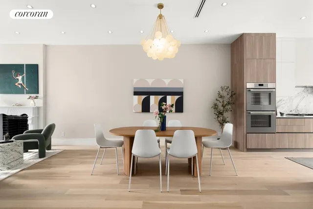 a large white kitchen with a large window