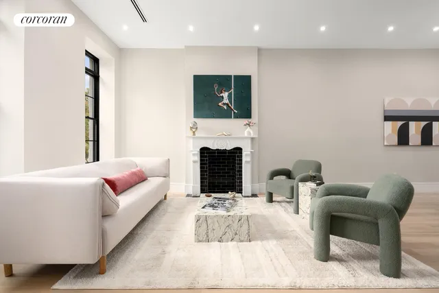 a view of a dining room with furniture and a chandelier