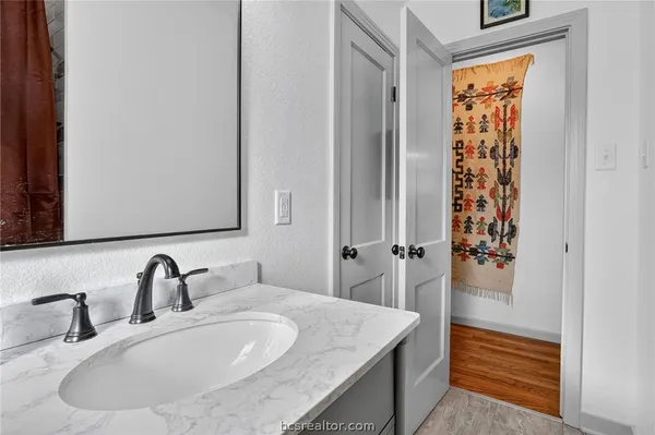 a bathroom with a sink and a mirror
