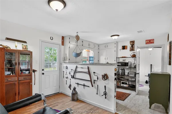 a view of livingroom with furniture and workspace
