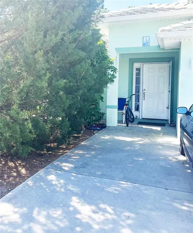 a view of a house with a yard and garage