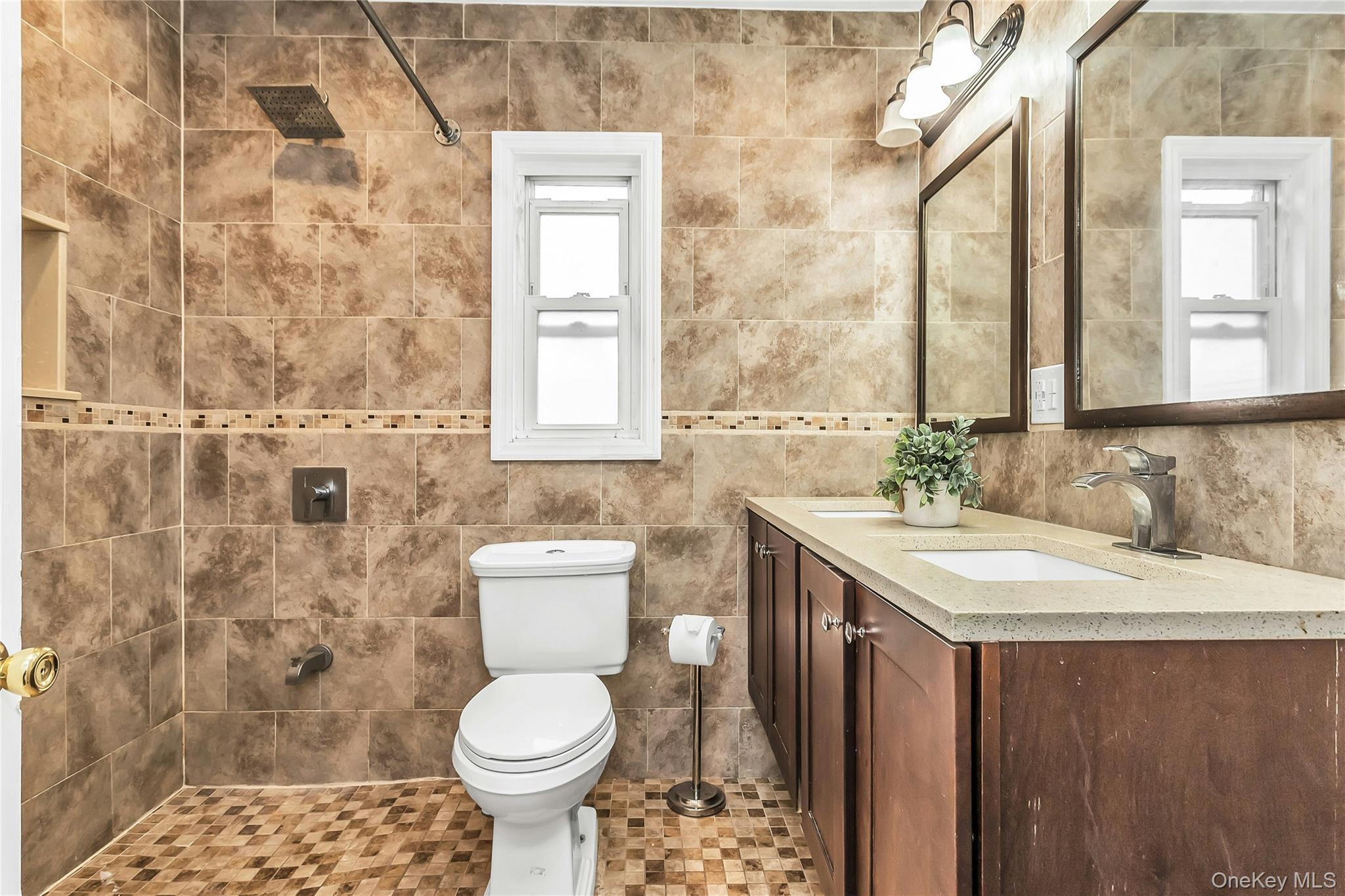 103 Union Street Valley Stream, NY 11580 - Photo 6 of 19 a bathroom with a sink toilet and a mirror