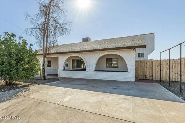 a front view of a house with parking area