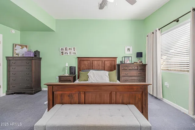 a room with a bed and furniture