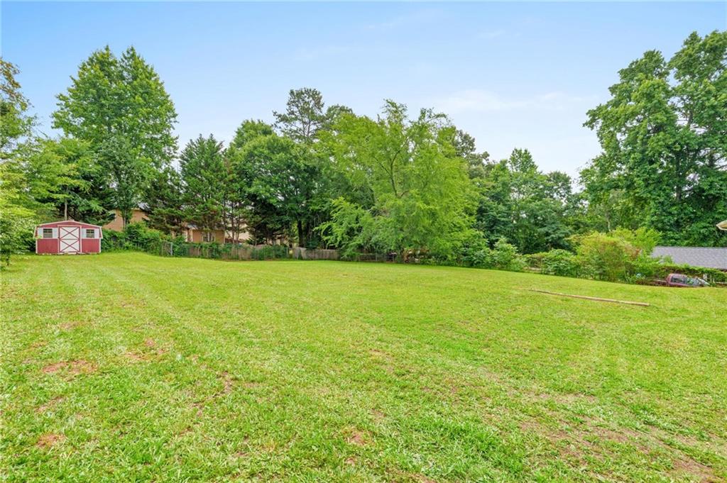 1745 Rockbridge Road Northwest Conyers, GA 30012 - Photo 26 of 32 a view of a garden and basketball court