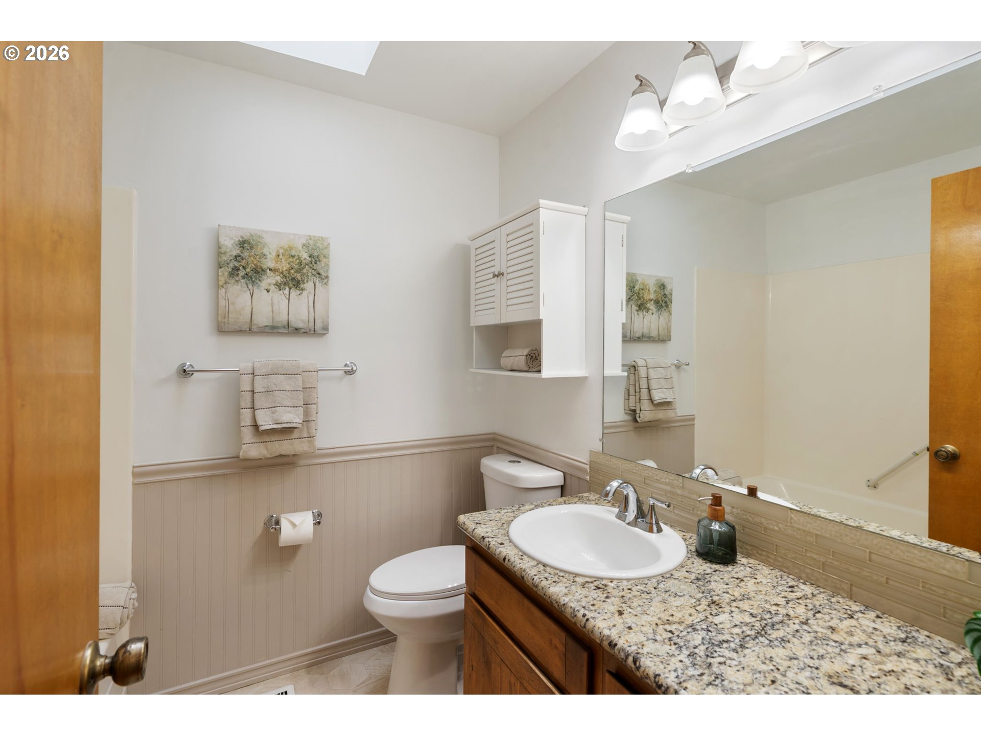 24950 Airport Road Northeast Aurora, OR 97002 - Photo 20 of 44 a bathroom with a granite countertop sink a toilet a mirror and shower