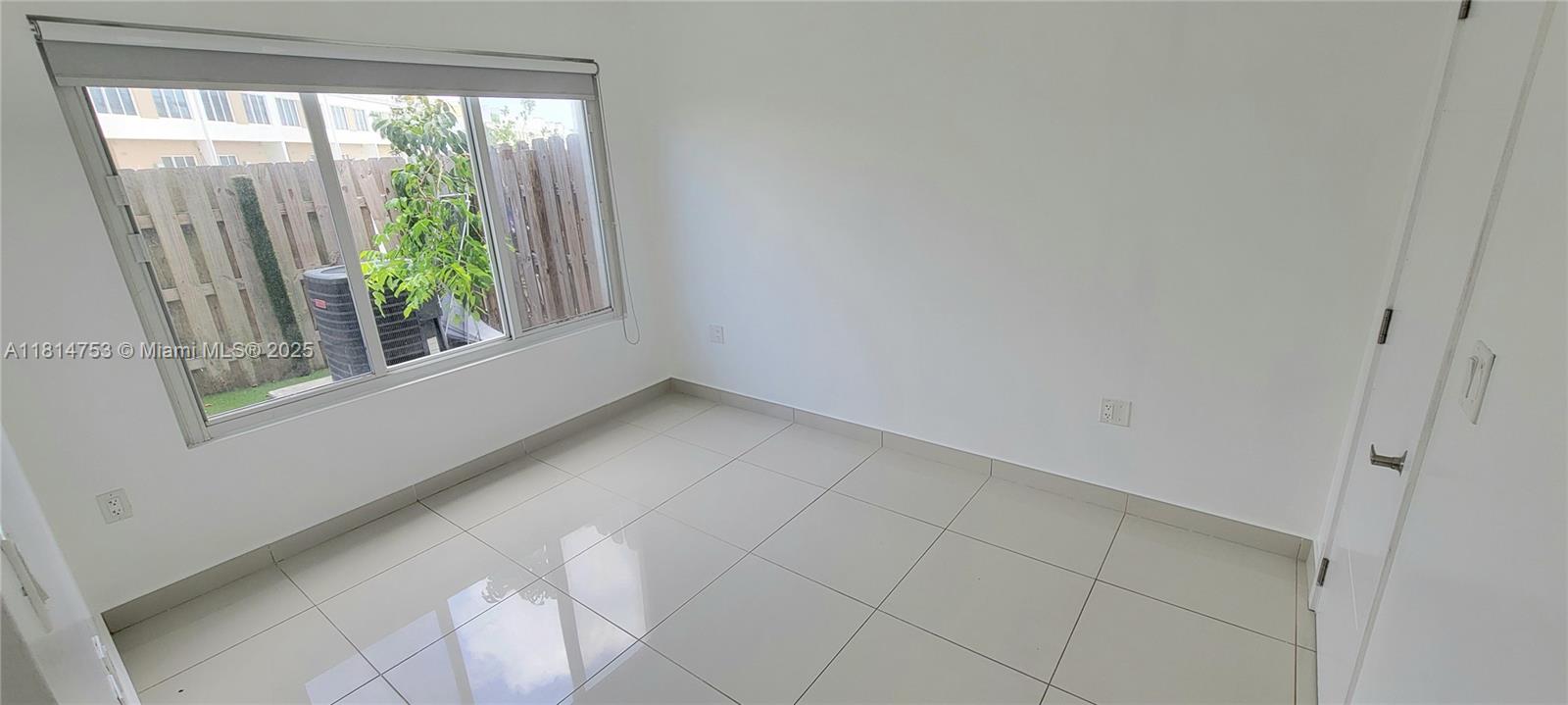 14004 Southwest 259th Street, Unit 14004 Homestead, FL 33032 - Photo 15 of 38 a view of empty room with window