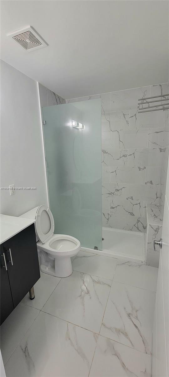 14004 Southwest 259th Street, Unit 14004 Homestead, FL 33032 - Photo 17 of 38 a bathroom with a toilet sink and shower