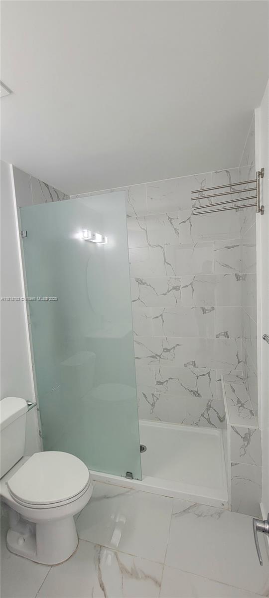 14004 Southwest 259th Street, Unit 14004 Homestead, FL 33032 - Photo 18 of 38 a bathroom with a toilet and a shower