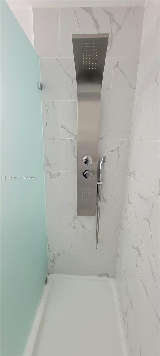 14004 Southwest 259th Street, Unit 14004 Homestead, FL 33032 - Photo 19 of 38 a bathroom with a shower