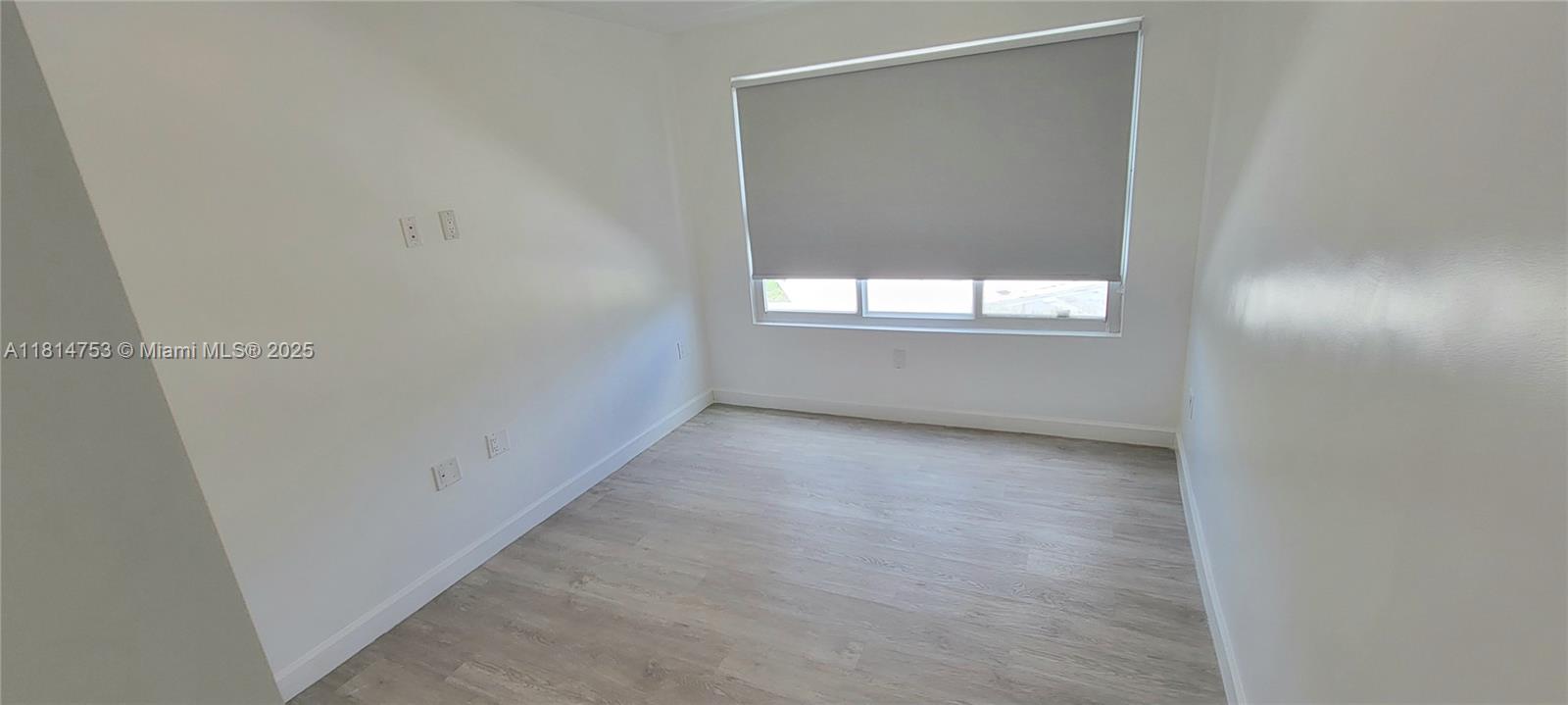 14004 Southwest 259th Street, Unit 14004 Homestead, FL 33032 - Photo 23 of 38 an empty room with a window