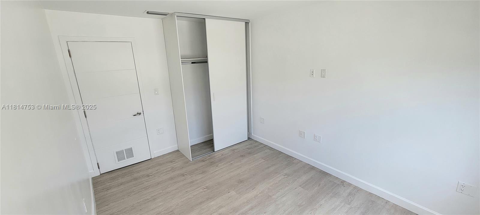 14004 Southwest 259th Street, Unit 14004 Homestead, FL 33032 - Photo 24 of 38 a view of an empty room