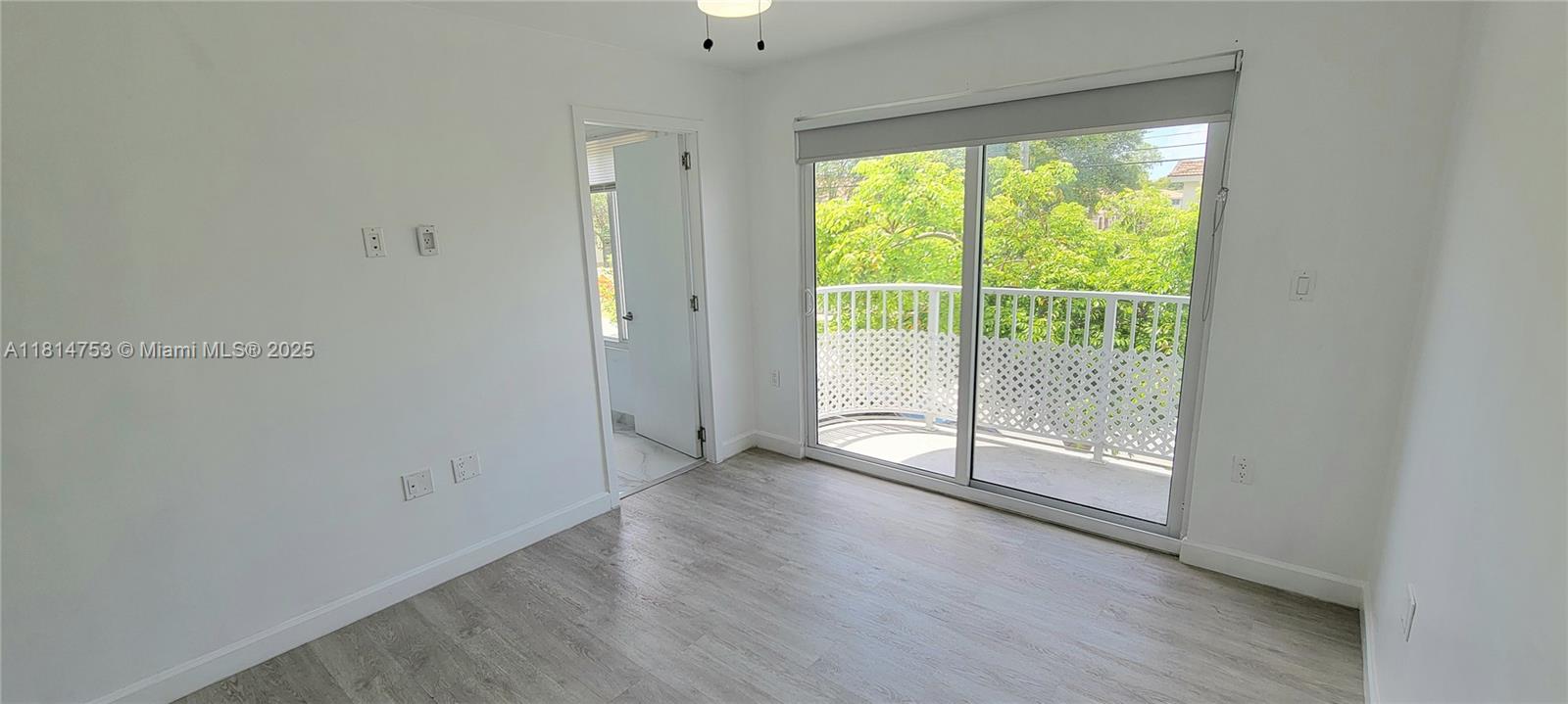 14004 Southwest 259th Street, Unit 14004 Homestead, FL 33032 - Photo 29 of 38 a view of a room with wooden floor and window
