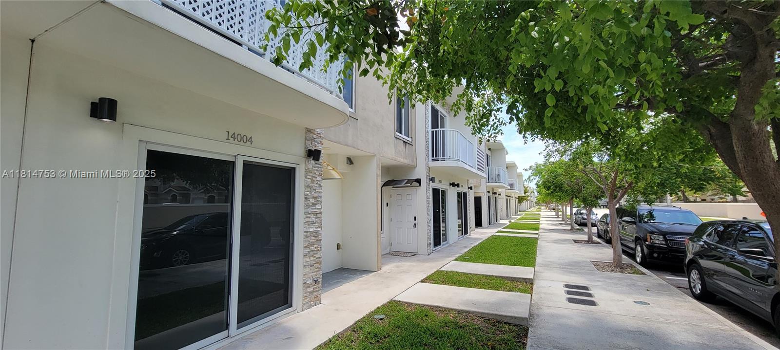 14004 Southwest 259th Street, Unit 14004 Homestead, FL 33032 - Photo 3 of 38 a view of backyard with patio