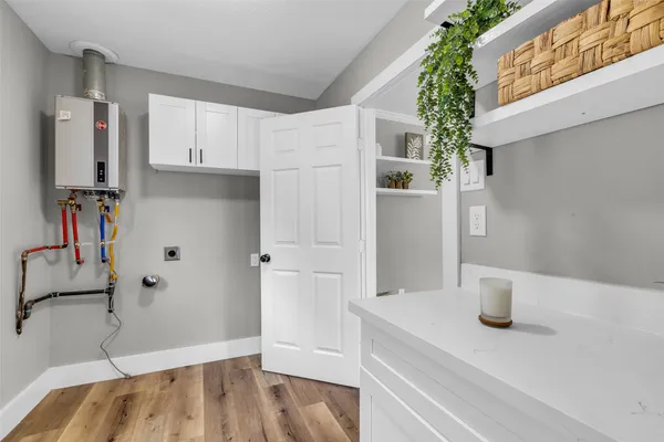 a kitchen with a refrigerator and sink