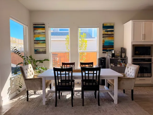 a view of a dining room with furniture window and outside view