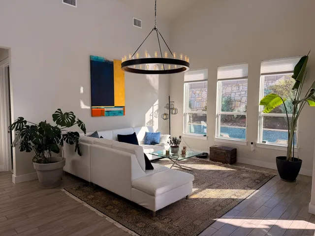 a living room with furniture and a large window