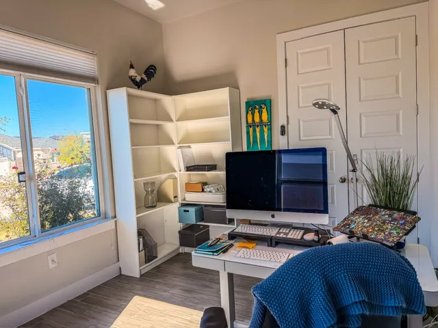 a bedroom with furniture and a window
