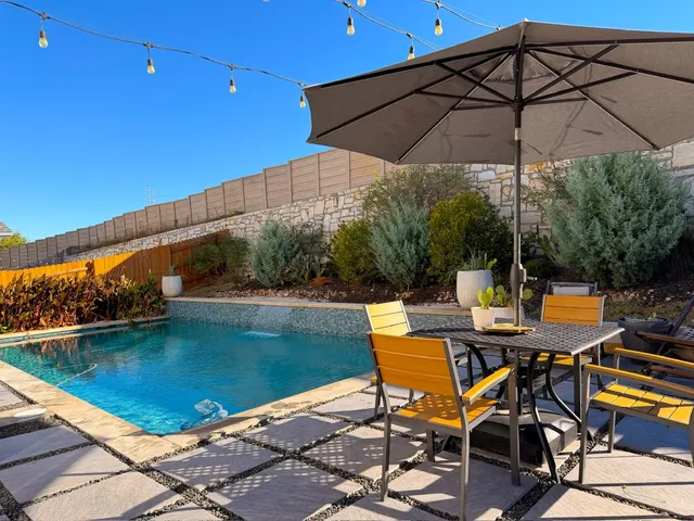 a view of a swimming pool with a patio