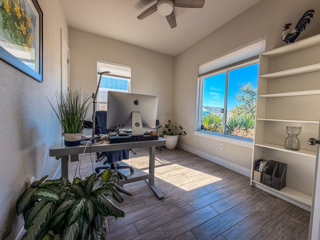 11001 Charger Way Manor, TX 78653 - Photo 21 of 36 a workspace with furniture window and wooden floor