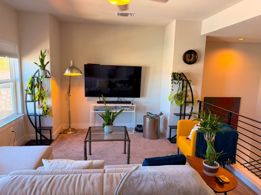 11001 Charger Way Manor, TX 78653 - Photo 24 of 36 a living room with furniture and a flat screen tv