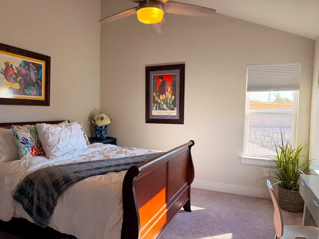 a bedroom with bed and a window