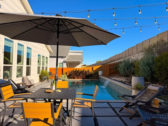 a view of an outdoor sitting area with swimming pool