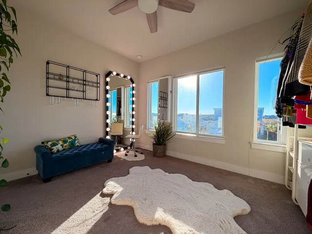 a living room with furniture toys and a window