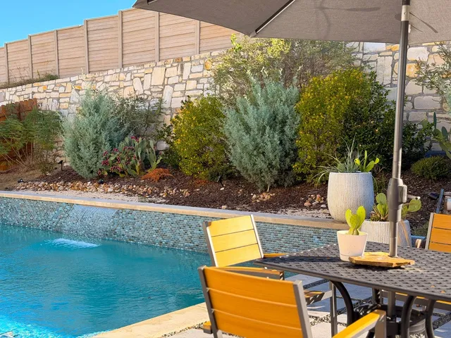a view of a swimming pool with a patio