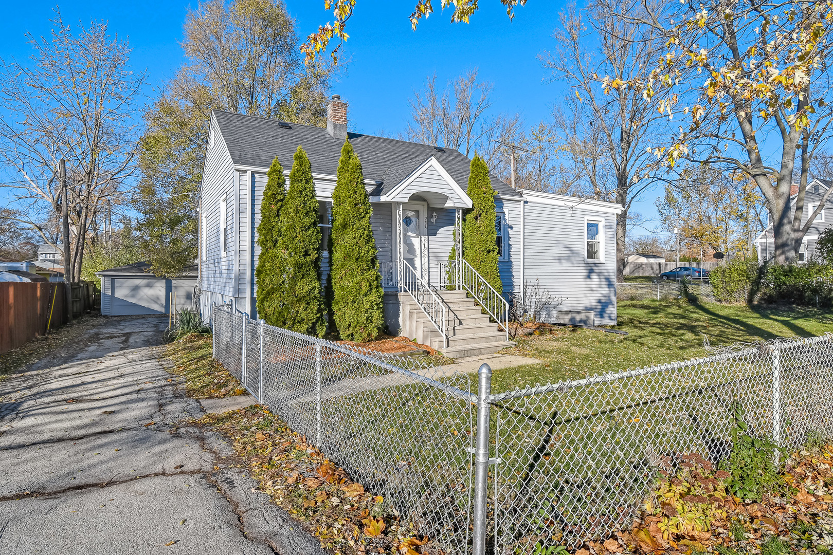 254 Village Road Willowbrook, IL 60527 - Photo 2 of 15 a view of a park with iron fence