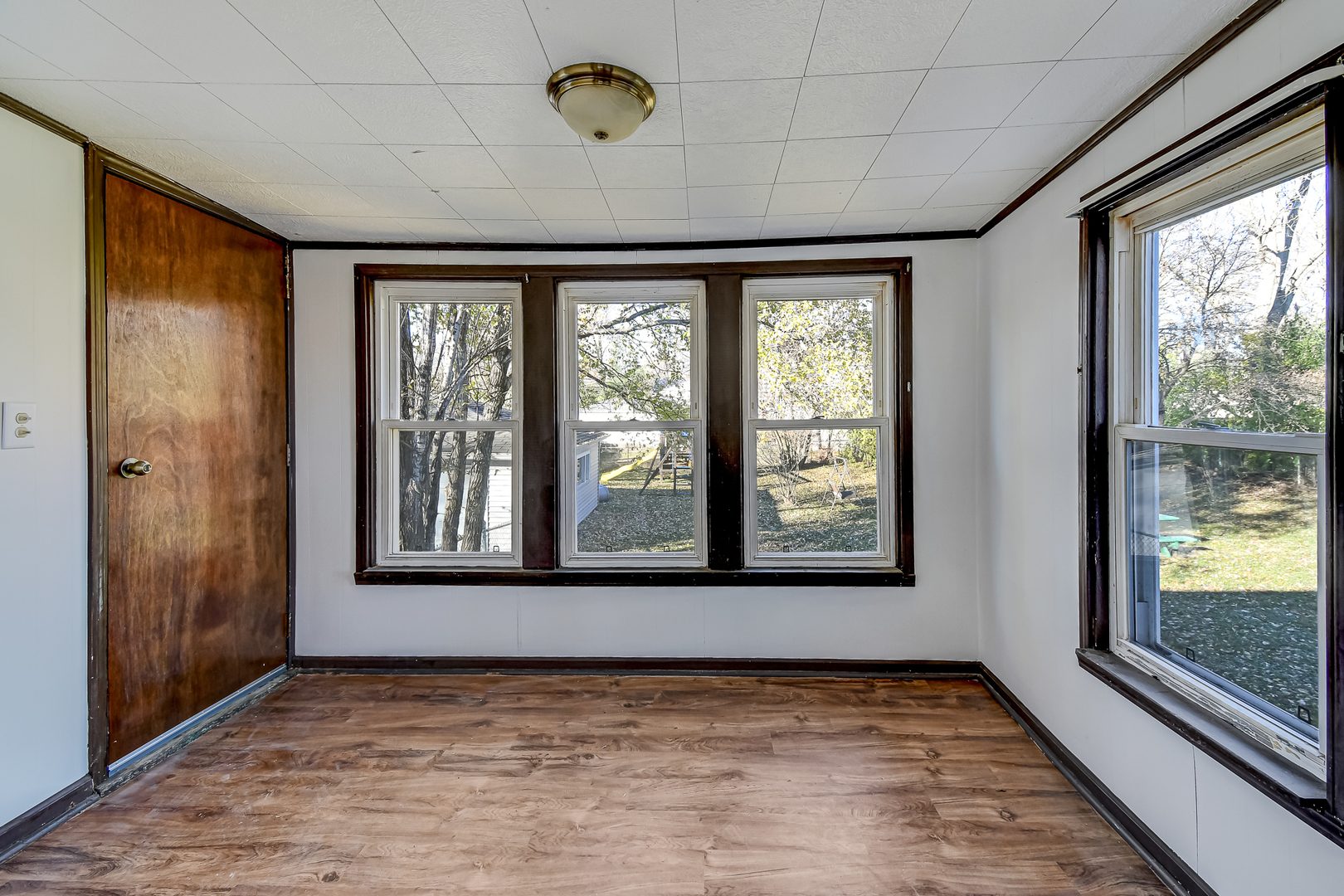254 Village Road Willowbrook, IL 60527 - Photo 8 of 15 a view of an empty room with a window and a ceiling fan