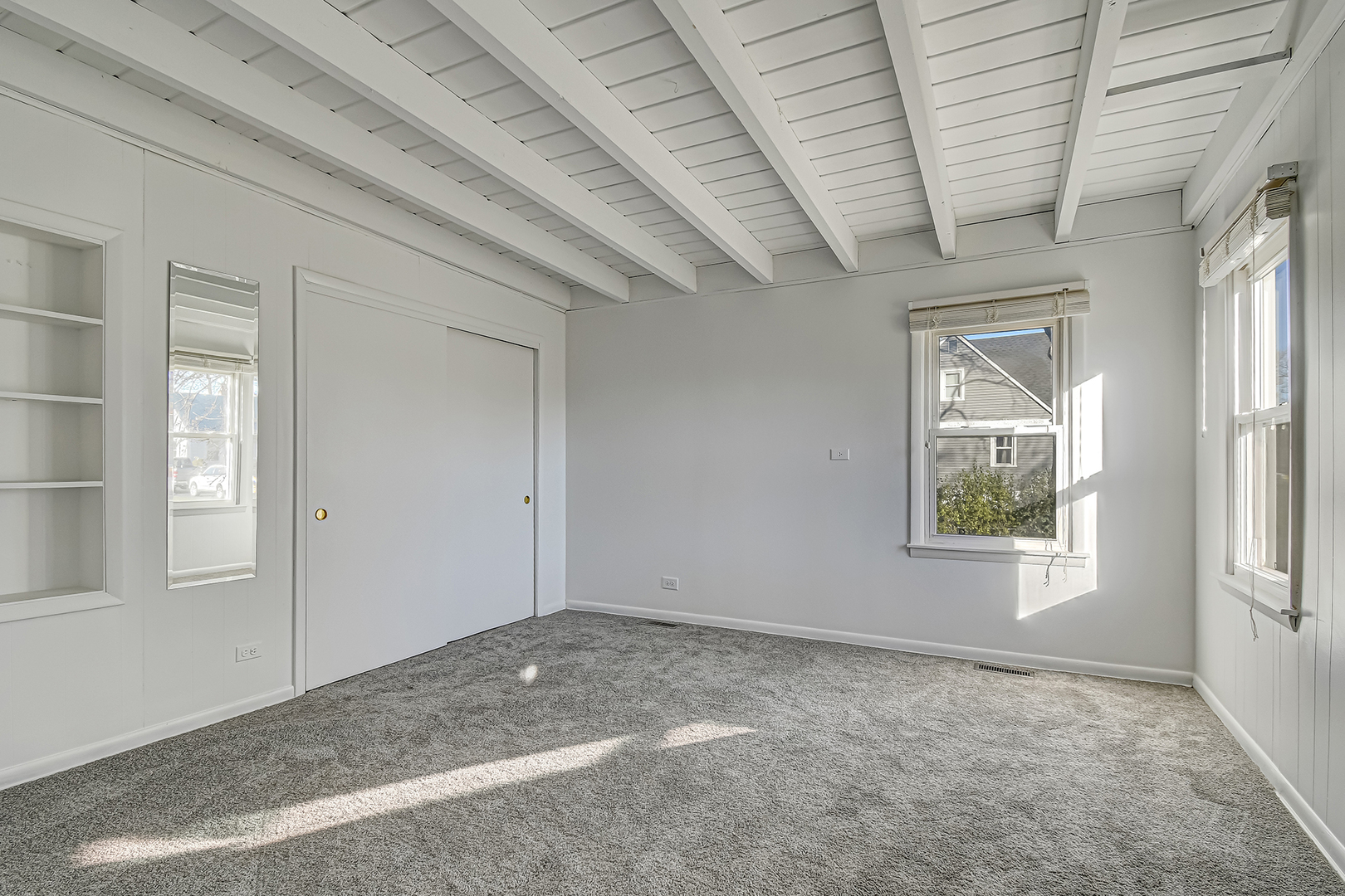 254 Village Road Willowbrook, IL 60527 - Photo 9 of 15 an empty room with windows