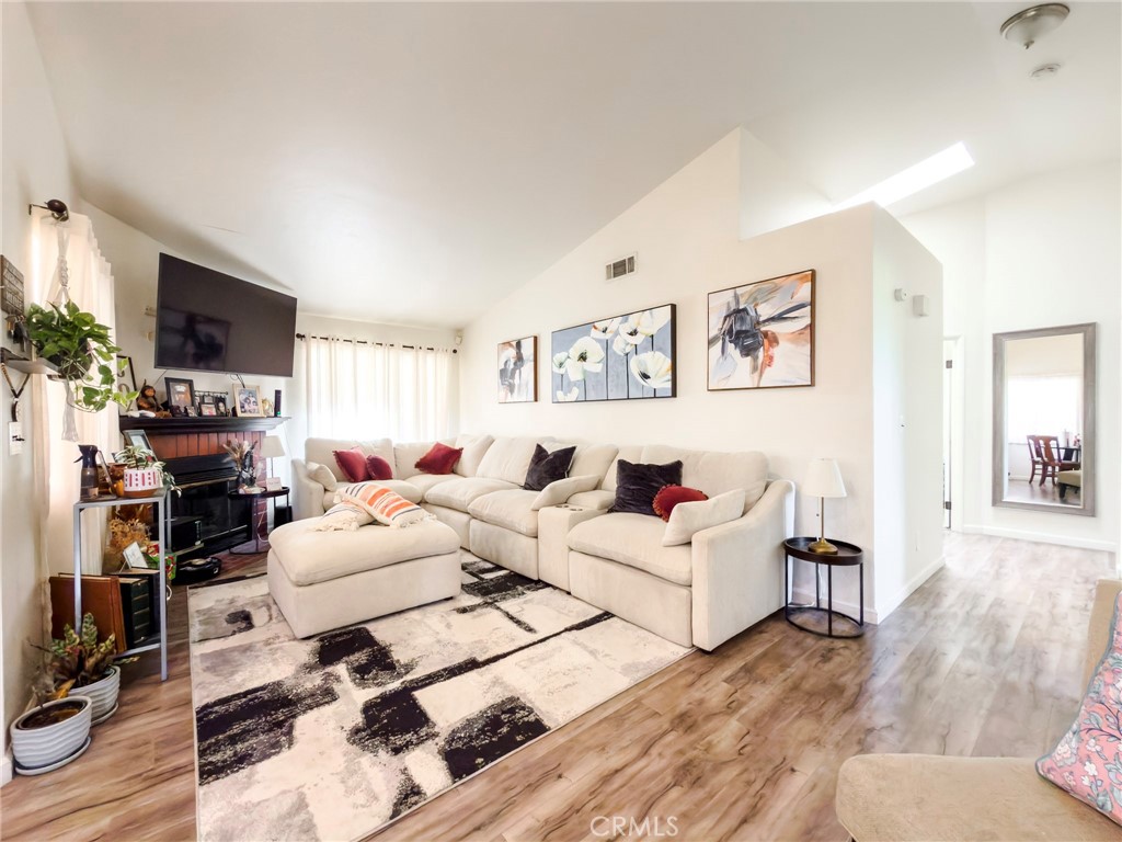 1738 The Willows Road San Jacinto, CA 92583 - Photo 17 of 34 a living room with furniture a flat screen tv and a window