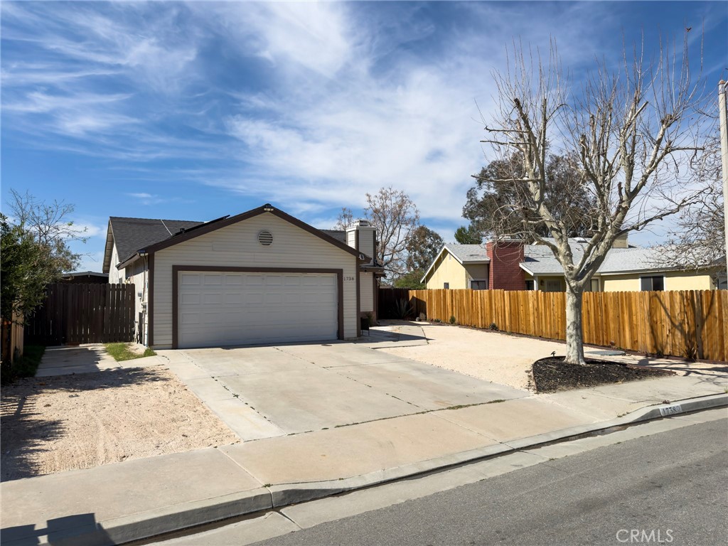 1738 The Willows Road San Jacinto, CA 92583 - Photo 3 of 34 a view of yellow house with a yard