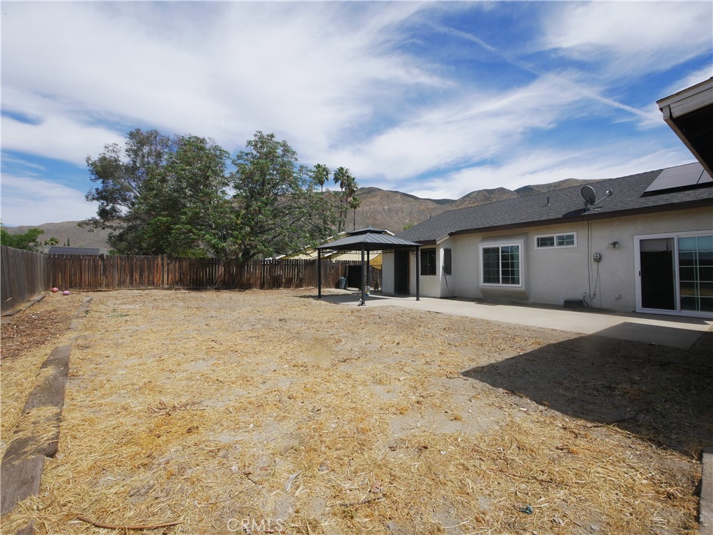1738 The Willows Road San Jacinto, CA 92583 - Photo 33 of 34 a front view of a house with a yard