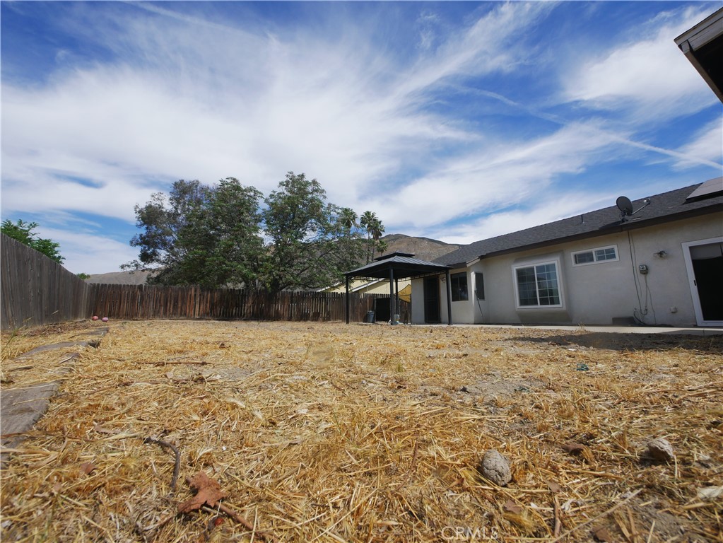 1738 The Willows Road San Jacinto, CA 92583 - Photo 34 of 34 a house with yard in front of it