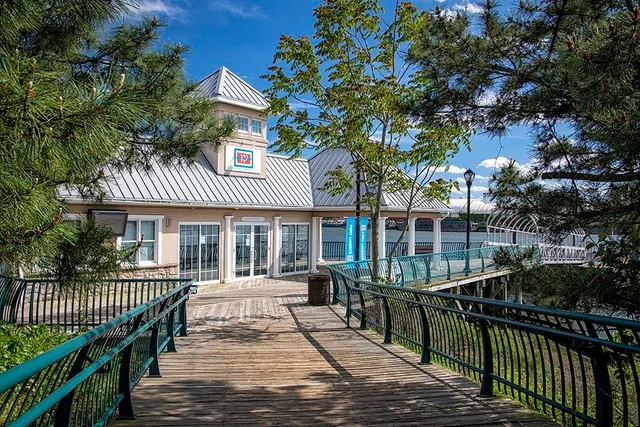 a view of a house with a wooden deck
