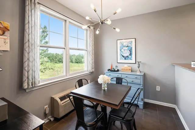a view of a dining room with furniture window and outside view