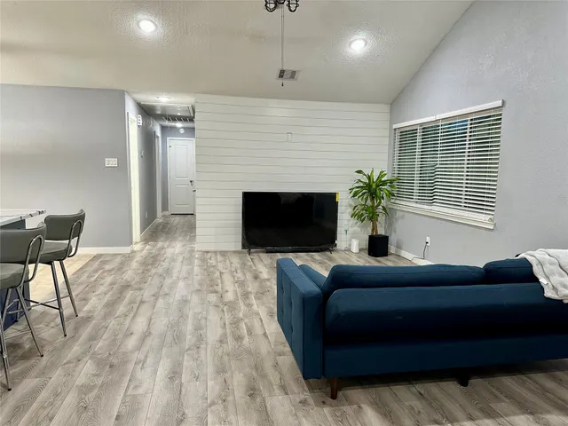 a bedroom with a bed and a fireplace